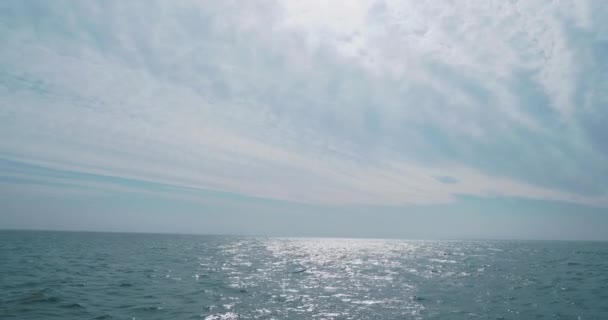 Panoramic cloudscape from moving yacht. Tranquil sea. Ocean cruise. Travel by sea. — Stock Video