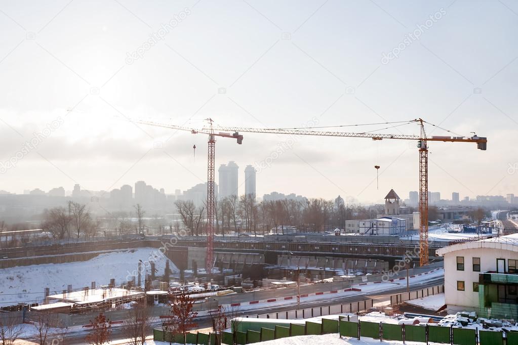 Construction near Poklonnaya Hill (Victory Park) in Moscow, Russia. Two cranes in winter sunny day.