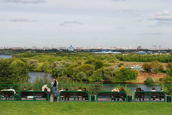 Panorama view from observation desk in Kolomenskoye Park. People walking and resting near Moscow-river. Moscow, Russia.