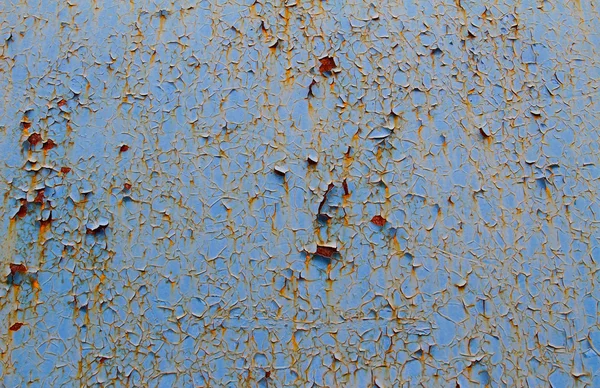 Pintura agrietada en pared de hierro oxidado — Foto de Stock