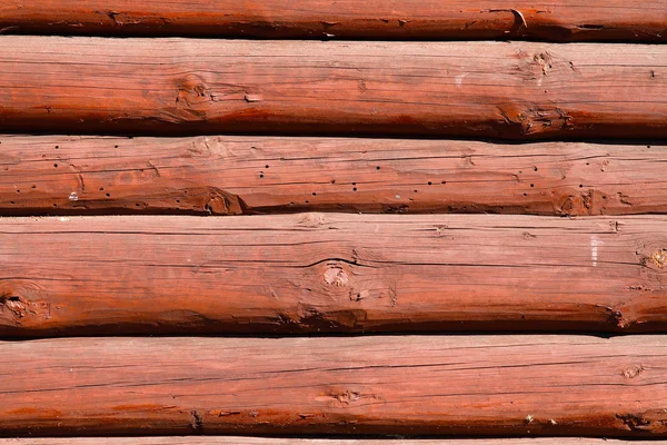 Pared de madera marrón hecha de troncos — Foto de Stock