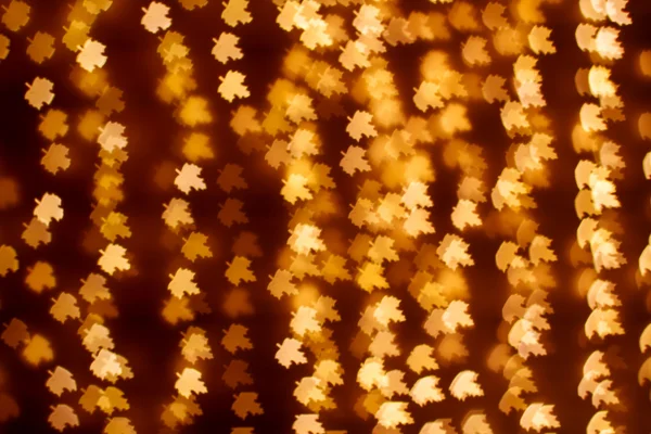 Blurring lights bokeh background of golden leaves — Stock Photo, Image
