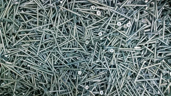 Achtergrond Textuur Van Lange Gegalvaniseerde Metalen Schroeven — Stockfoto