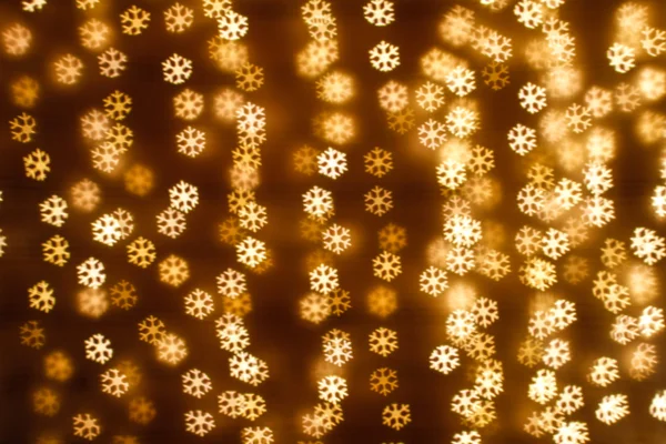 Blurring lights bokeh background of snowflakes — Stock Photo, Image