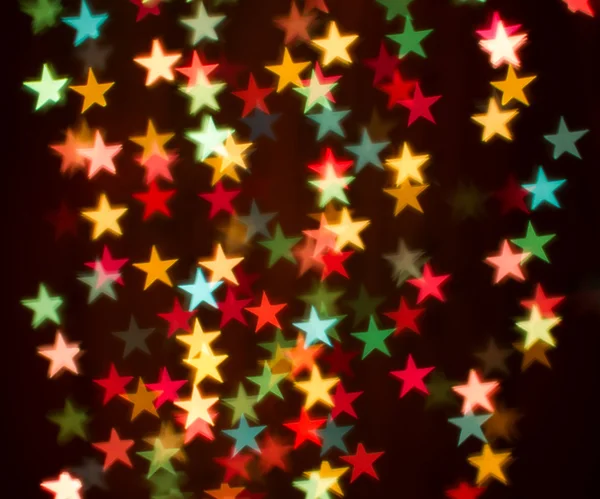 Blurring lights bokeh background of colorful stars — Stock Photo, Image