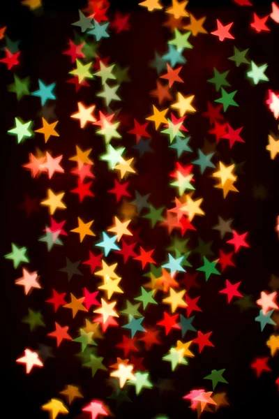Blurring lights bokeh background of colorful stars — Stock Photo, Image