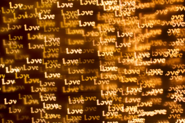 Blurring lights bokeh background of words LOVE — Stock Photo, Image