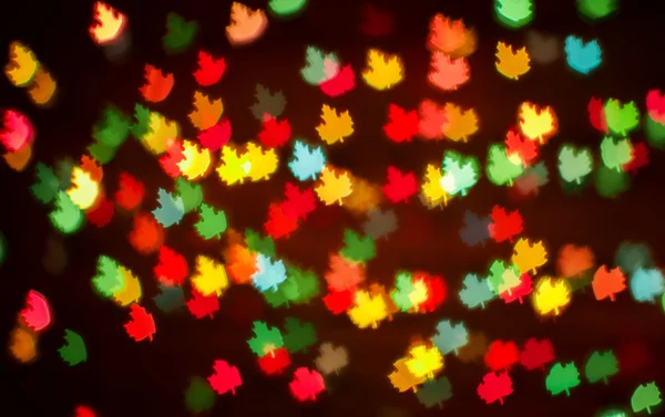 Blurring lights bokeh background of colorful leaves — Stock Photo, Image