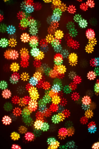 Blurring lights bokeh background of colorful flowers — Stock Photo, Image