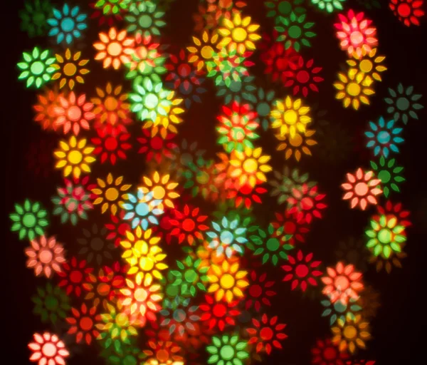 Blurring lights bokeh background of colorful flowers — Stock Photo, Image