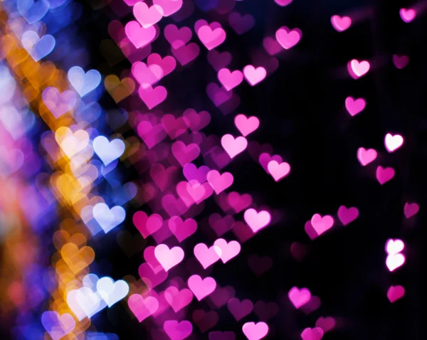 Blurring lights bokeh background of hearts — Stock Photo, Image