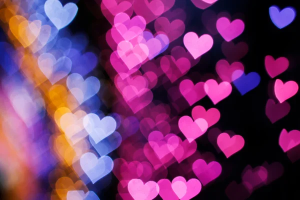 Blurring lights bokeh background of hearts — Stock Photo, Image