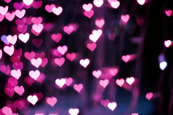 Blurring lights bokeh background of pink hearts — Stock Photo, Image