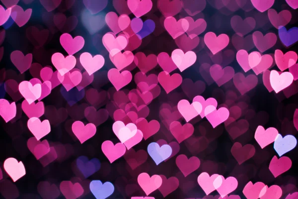 Blurring lights bokeh background of pink hearts — Stock Photo, Image