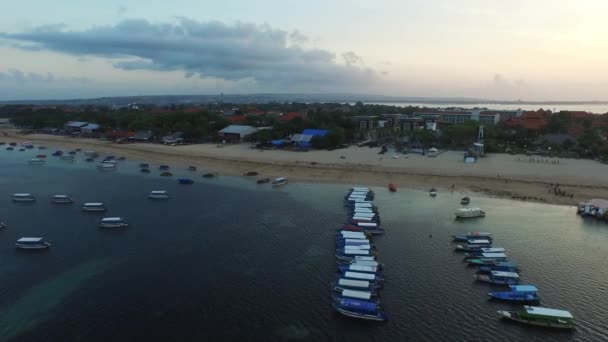 Flying over the boats to the shore — Stock Video