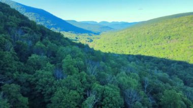 Aerial drone video footage of summer time in the Catskill Mountains in New Yorks Hudson Valley. The Catskills are a sub-range of the Appalachian Mountains on the east coast of the United States.