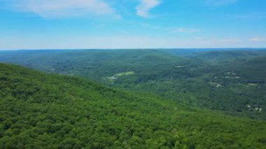 Aerial drone footage of summer time in the Catskill Mountains in New Yorks Hudson Valley. The Catskills are a sub-range of the Appalachian Mountains on the east coast of the United States.