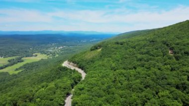 Aerial drone video footage of a scenic mountain highway byway in the Appalachian Mountains. This is in the Shawangunk Mountain sub-range in new yorks Hudson valley during summer time. 