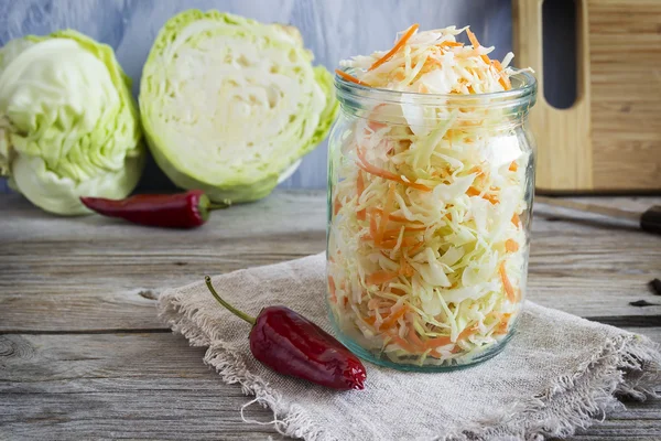 Pickled cabbage with carrots and red hot peppers — Stock Image Pickled cabbage with carrots and red hot peppers Royalty Free Stock Photos