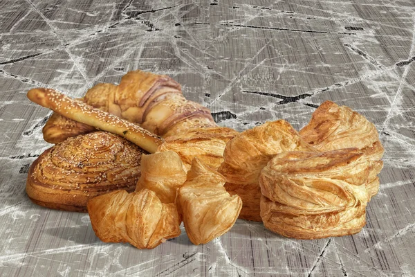 Bunch of Sesame Croissant Puff Pastry On Old Scratched Cracked Flaky Wooden Surface