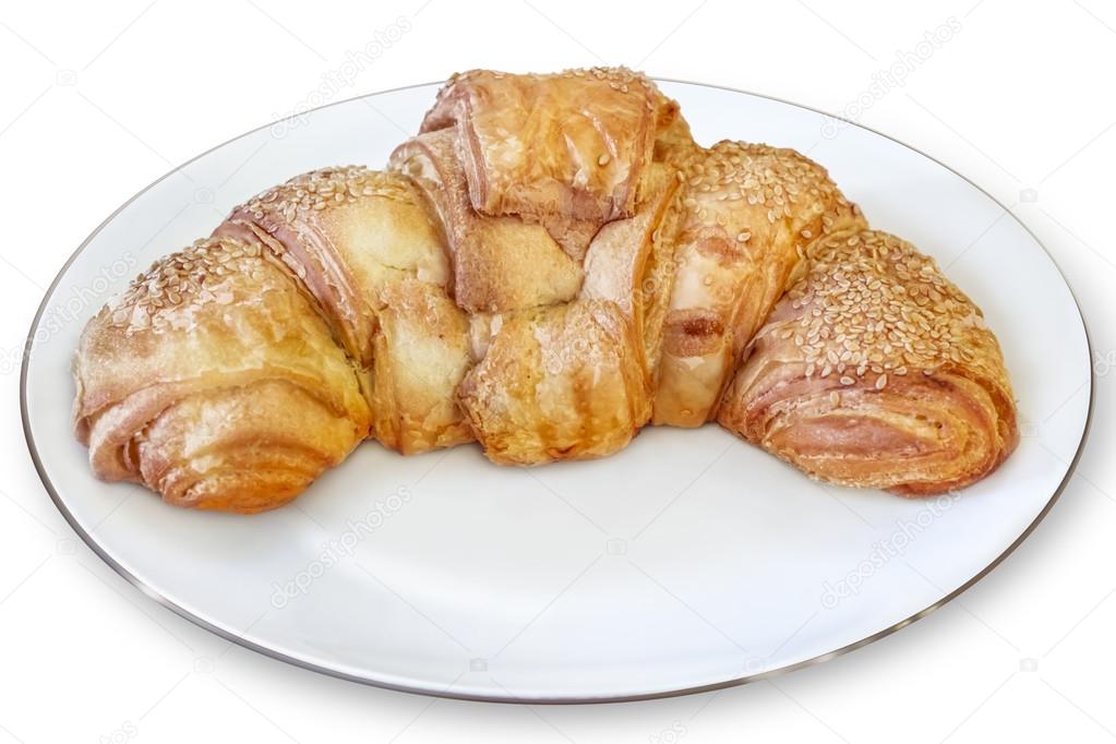 Croissant Puff Pastry Roll in White Porcelain Plate Isolated