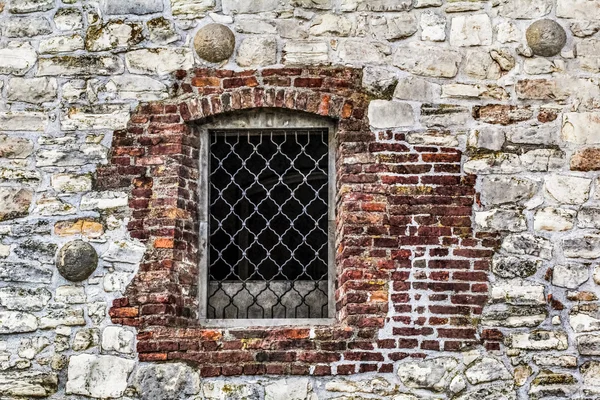 Stone Brick Rampart with Ornamental Wrought Iron Safeguard Protected Window — Stock Photo, Image