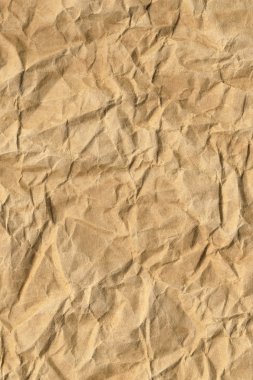Koyu sarı-kahverengi Kraft kağıt kaba ezilmiş buruşuk Grunge doku geri dönüşüm