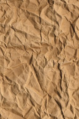 Koyu sarı-kahverengi Kraft kağıt kaba ezilmiş buruşuk Grunge doku geri dönüşüm