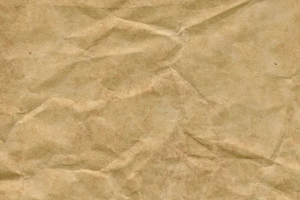 Koyu sarı-kahverengi Kraft kağıt kaba ezilmiş buruşuk Grunge doku geri dönüşüm — Stok fotoğraf