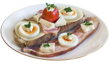 Bacon Cheese Egg Ham and Tomato Sandwich on Plate Isolated