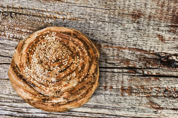 Puff Paste Sesame Roll On Old Cracked Wood Background — Stock Photo, Image