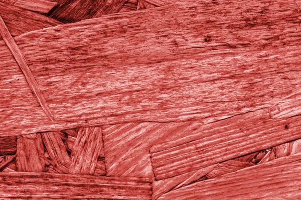 Panneau de particules blanchies et teintes rouges texture grossière grunge — Photo