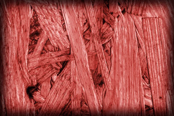 Spaanplaat gebleekt en rood gekleurd grof vignet Grunge textuur — Stockfoto