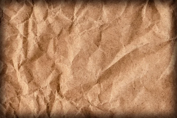 Geri dönüşüm kahverengi Kraft kağıt torba kaba tahıl ezilmiş buruşuk Vignette Grunge doku detay — Stok fotoğraf