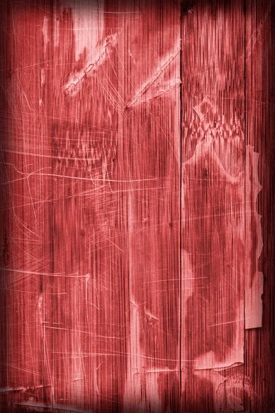 Vieja madera laminado panel rojo manchado barnizado agrietado rayado pelado viñeta grunge textura — Foto de Stock