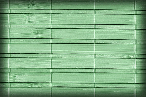 Tapis de bambou blanchi et teint Vignette verte pâle Échantillon de texture grunge — Photo