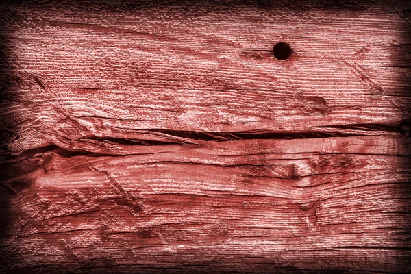 Viejo anudado envejecido agrietado madera podrida manchada viñeta roja Grunge textura — Foto de Stock