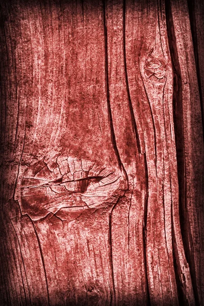 Alte geknotete verwitterte rissige morsche Holz gefärbte rote Vignette Grunge Textur — Stockfoto