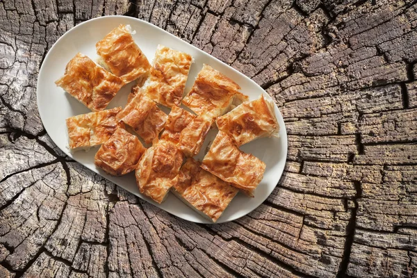 Plateful of Serbian Cheese Pie Gibanica on Old Cracked Stump Surface — Stock Photo, Image