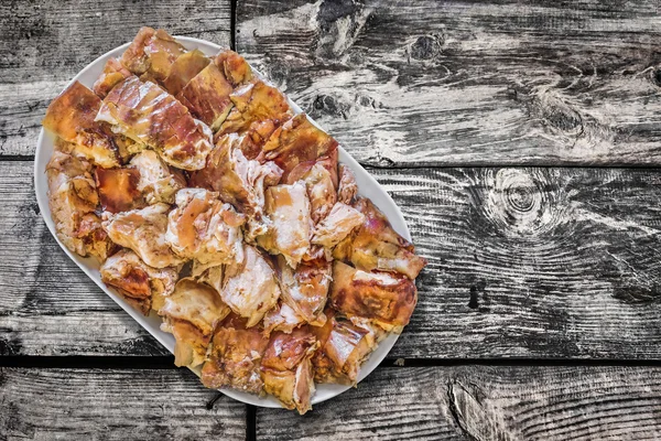 Plateful of Spit Roasted Pork Slices on Old Weathered Wooden Floorboards Surface — Stok Foto