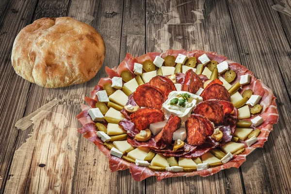 Plateful of Serbian Appetizer Meze with Pita Bread on Old Cracked Floorboards Background — Stock Photo, Image