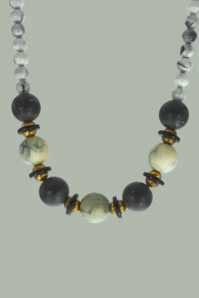Beads from a gray stone on a gray background — Stock Image Beads from a gray stone on a gray background Stock Image