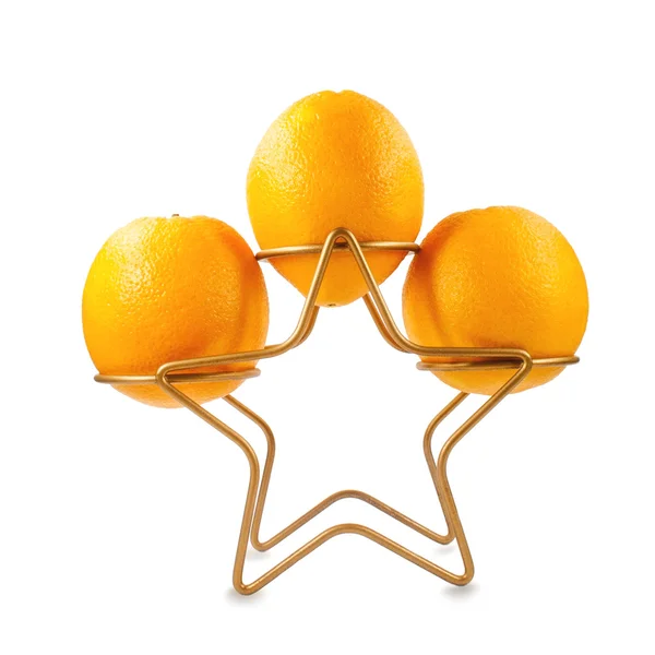 Sinaasappelen op de stand gouden ster — Stockfoto