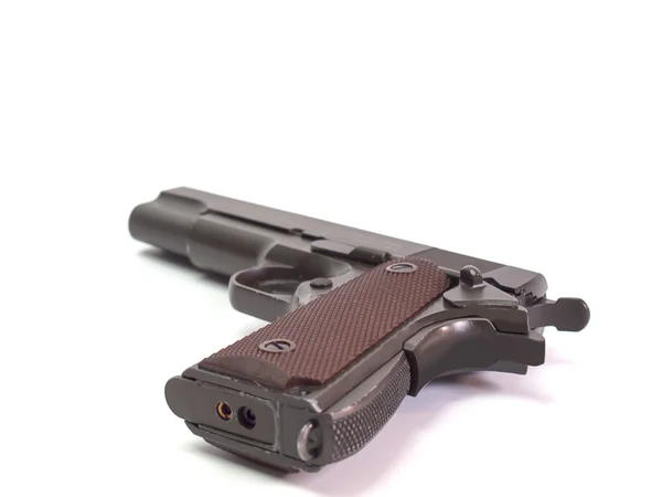 Pistola, colocada sobre un fondo blanco —  Fotos de Stock