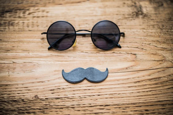 Sunglasses andwhite paper mustache — Stock Photo, Image