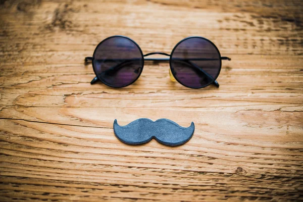 Sunglasses andwhite paper mustache — Stock Photo, Image