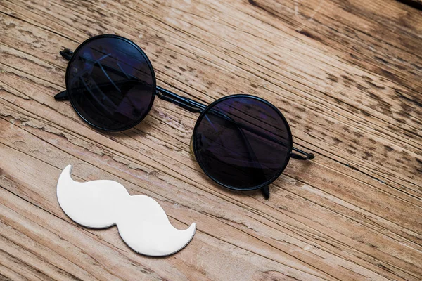 Sunglasses andwhite paper mustache — Stock Photo, Image