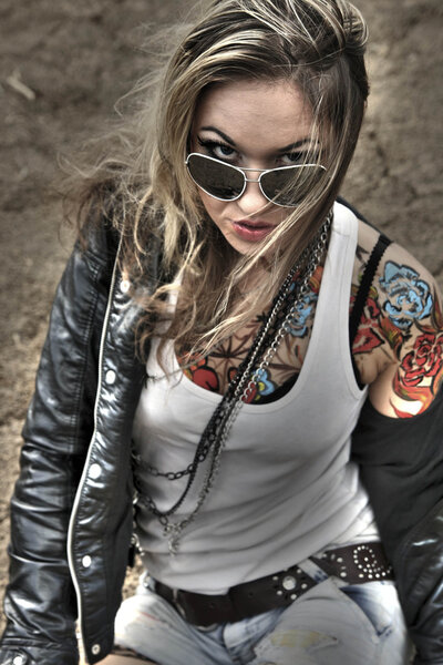 Portrait of stylish tattoo woman