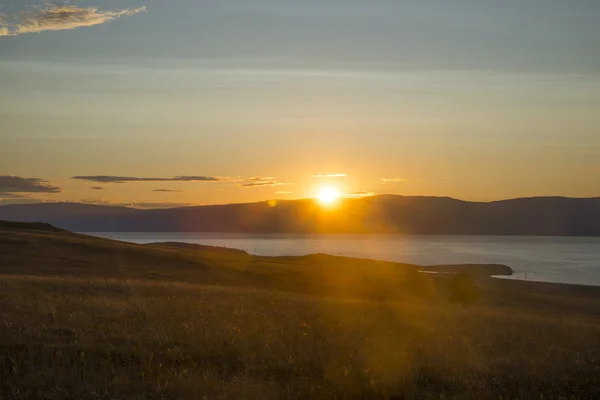 sunset or Sunrise over mountains stones