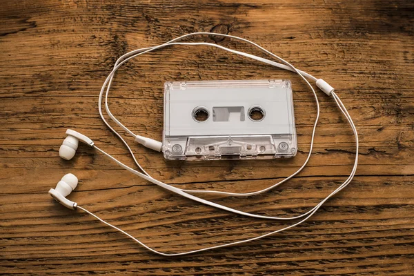 Earphones and cassette tape — Stock Photo, Image